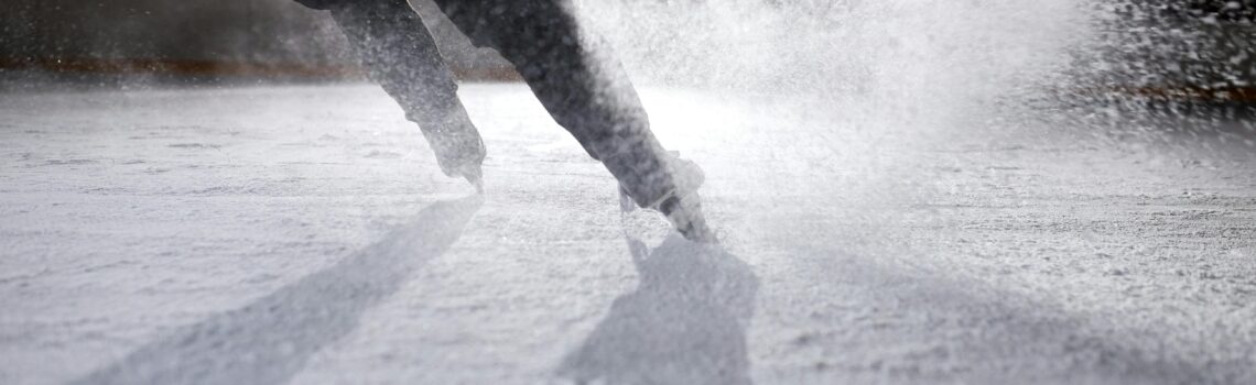 a-person-ice-skating-on-ice-rink